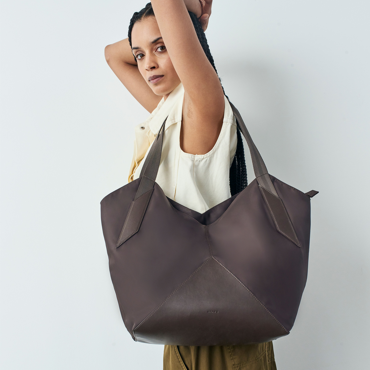 woman holding STATE Bags Beverly Tote Brown 