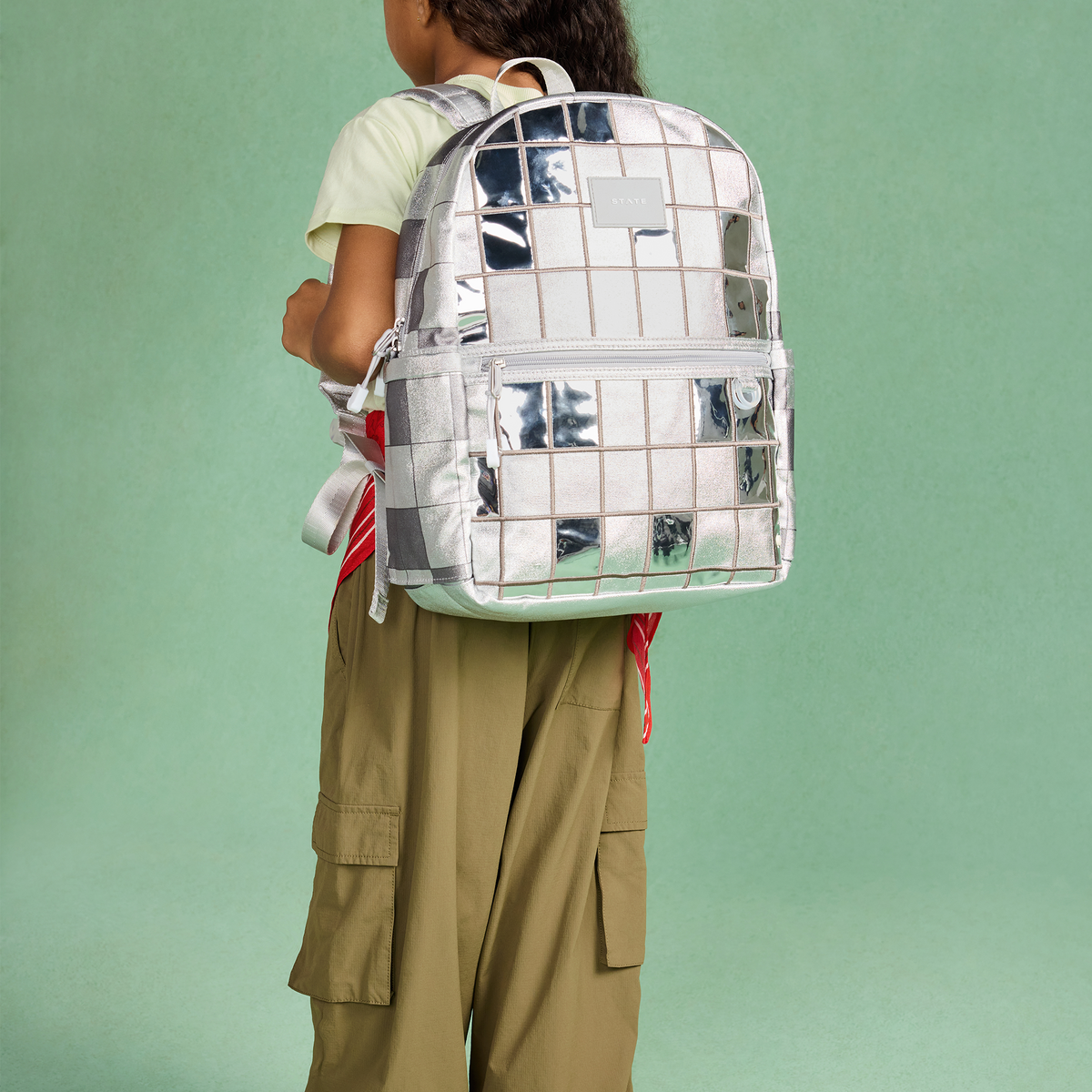 girl wearing STATE Bag Kane Double Pocket Backpack disco balls