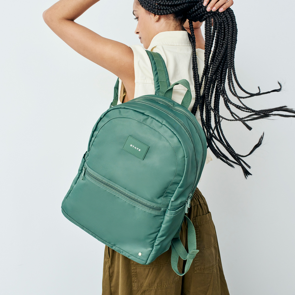 woman wearing STATE Bags Evans Double Pocket Olive 