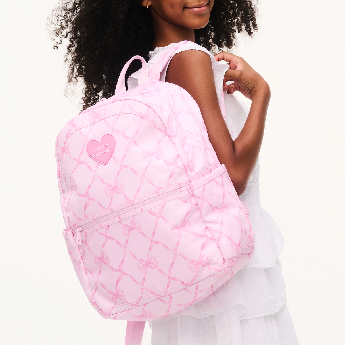 girl wearing STATE x LoveShackFancy Kane Double Pocket Backpack