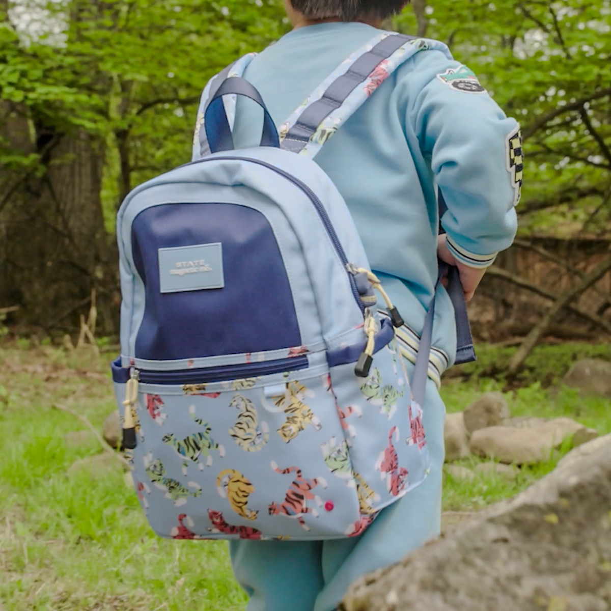 Boy wearing STATE x MagneticMe Kane Mini Backpack Tigers