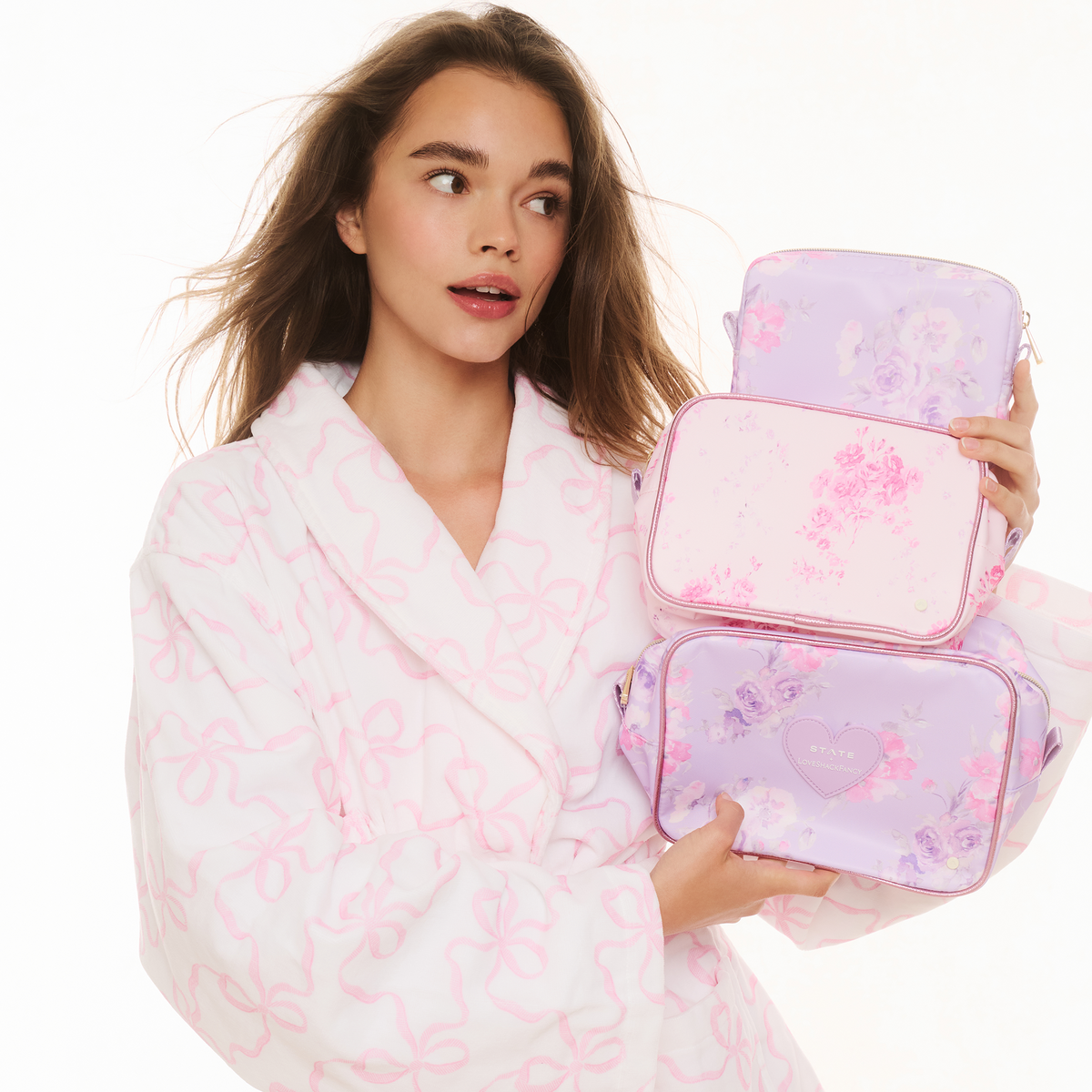 Girl holding STATE x LoveShack Fancy Travel Pouch Set Happy Thoughts