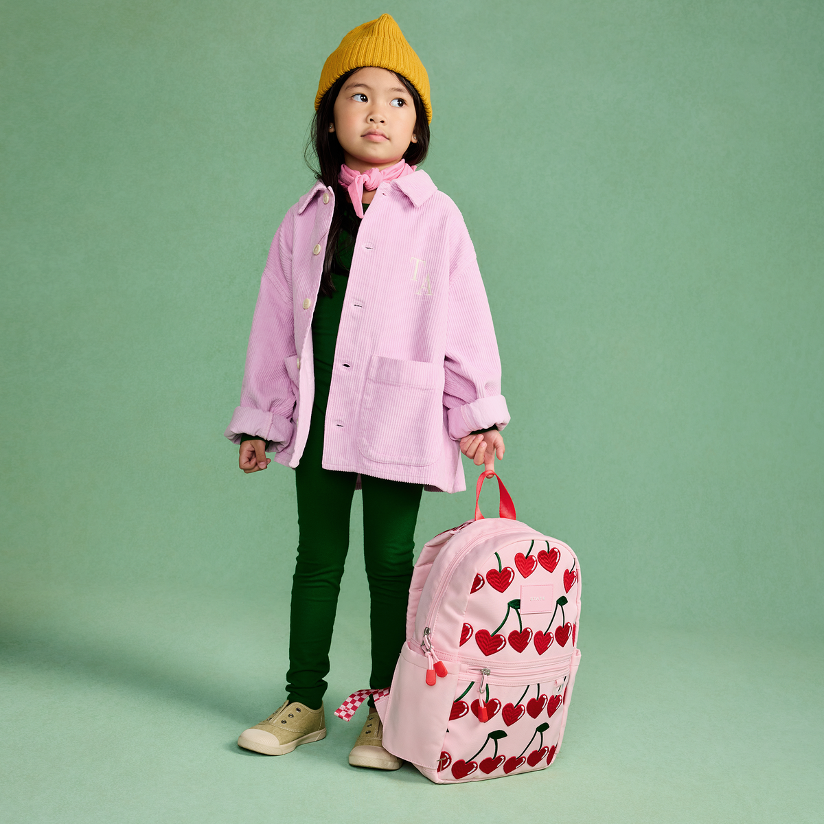 girl wearing STATE Bags Kane Mini Backpack Cherry
